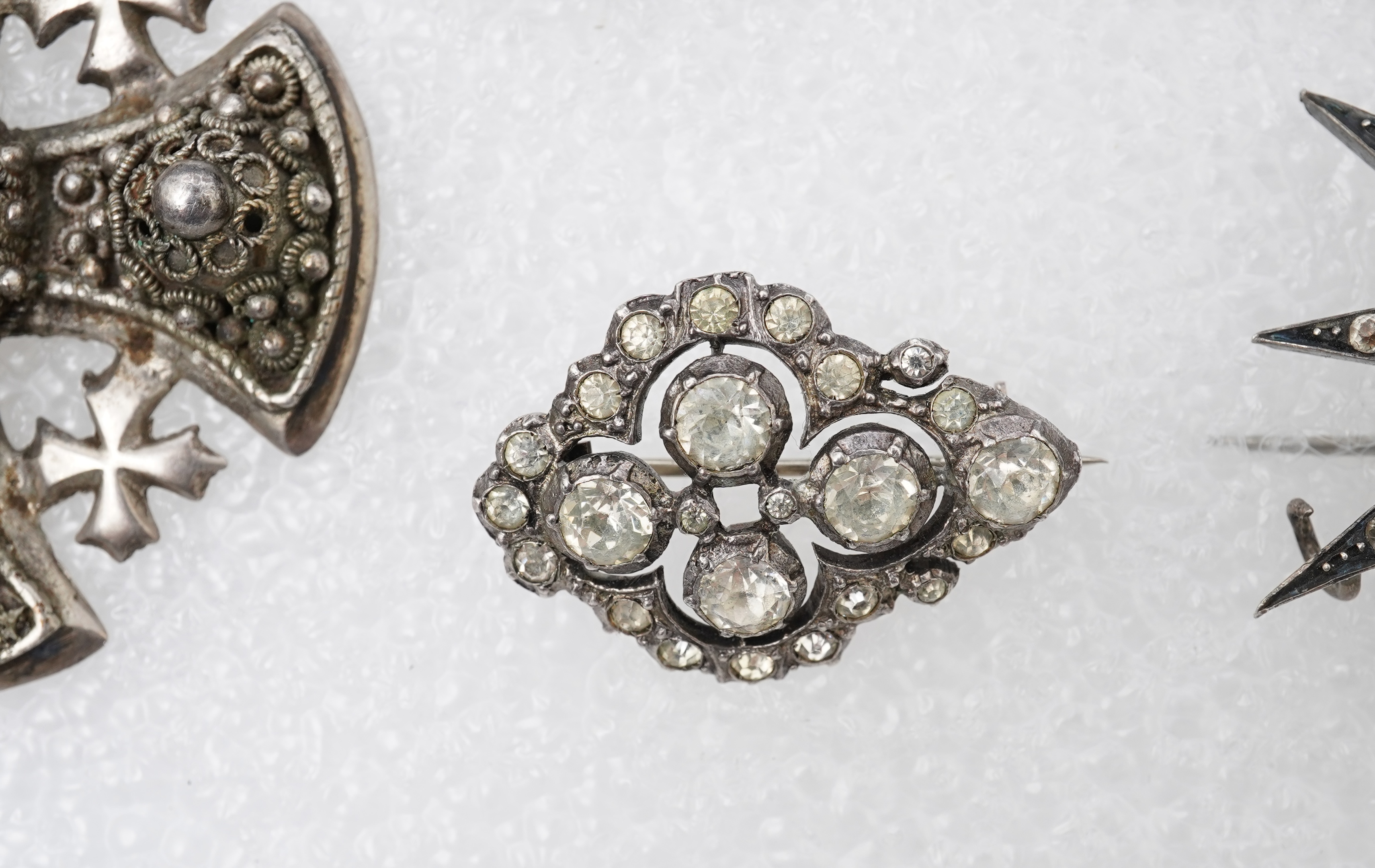 A group of jewels, comprising: a late 19th century and later Renaissance revival-style pendant set with an oval turquoise cabochon, circular-cut garnets and circular-cut green chalcedony, mounted in silver, length 6cm, s